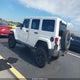 1C4HJWEG7EL272964 2014 Jeep Wrangler Unlimited Sahara auction photo thumbnail 3