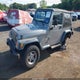 1J4FA49S3YP774212 2000 Jeep Wrangler Sport auction photo thumbnail 2