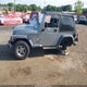 1J4FA49S3YP774212 2000 Jeep Wrangler Sport auction photo thumbnail 6