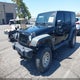 1C4BJWDGXCL111805 2012 Jeep Wrangler Unlimited Sport auction photo thumbnail 2