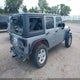1C4BJWDGXGL301464 2016 Jeep Wrangler Unlimited Sport auction photo thumbnail 4