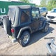 1J4FA59S02P703627 2002 Jeep Wrangler Sahara auction photo thumbnail 4