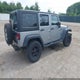 1C4BJWDG0FL556123 2015 Jeep Wrangler Unlimited Sport auction photo thumbnail 4