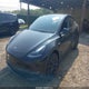 7SAYGAEE4PF940258 2023 Tesla Model Y Awd/Long Range Dual Motor All-Wheel Drive auction photo thumbnail 2