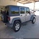 1C4BJWDG6FL570527 2015 Jeep Wrangler Unlimited Sport auction photo thumbnail 4