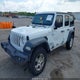 1C4HJXDG5JW252714 2018 Jeep Wrangler Unlimited Sport S 4X4 auction photo thumbnail 2