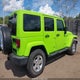 1C4BJWDG4EL133785 2014 Jeep Wrangler Unlimited Sport auction photo thumbnail 4