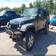 1J4BA3H15AL212956 2010 Jeep Wrangler Unlimited Sport auction photo thumbnail 2