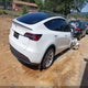 7SAYGDEE4PA083826 2023 Tesla Model Y Awd/Long Range Dual Motor All-Wheel Drive auction photo thumbnail 4