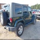 1J4BA5H12AL221027 2010 Jeep Wrangler Unlimited Sahara auction photo thumbnail 4
