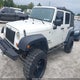 1J4BA3H11AL125443 2010 Jeep Wrangler Unlimited Sport auction photo thumbnail 2