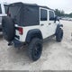 1J4BA3H11AL125443 2010 Jeep Wrangler Unlimited Sport auction photo thumbnail 4