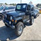 1J4FA59SXYP772771 2000 Jeep Wrangler Sahara auction photo thumbnail 2