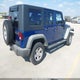 1J4BA3H13AL217914 2010 Jeep Wrangler Unlimited Sport auction photo thumbnail 4