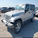 1J4GA59129L717204 2009 Jeep Wrangler Unlimited Sahara auction photo thumbnail 2