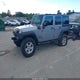 1C4BJWDG0FL521002 2015 Jeep Wrangler Unlimited Sport auction photo thumbnail 2
