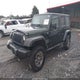 1J4BA3H16AL101686 2010 Jeep Wrangler Unlimited Sport auction photo thumbnail 2