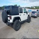 1J4BA3H18AL228245 2010 Jeep Wrangler Unlimited Sport auction photo thumbnail 4