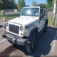 1J4BA3H12AL170892 2010 Jeep Wrangler Unlimited Sport auction photo thumbnail 2