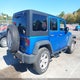 1C4BJWDG6FL557227 2015 Jeep Wrangler Unlimited Sport auction photo thumbnail 4