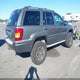 1J8GW68J43C606216 2003 Jeep Grand Cherokee Overland auction photo thumbnail 4