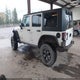 1J4HA5H16AL151400 2010 Jeep Wrangler Unlimited Sahara auction photo thumbnail 3