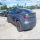 7SAYGDEE8PA044835 2023 Tesla Model Y Awd/Long Range Dual Motor All-Wheel Drive auction photo thumbnail 3