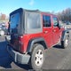 1J4BA3H11AL130447 2010 Jeep Wrangler Unlimited Sport auction photo thumbnail 4