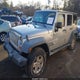 1J4BA3H15AL166867 2010 Jeep Wrangler Unlimited Sport auction photo thumbnail 2