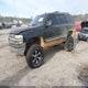 1GNEC13T05J230011 2005 Chevrolet Tahoe Lt auction photo thumbnail 2