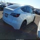 7SAYGAEE5PF886680 2023 Tesla Model Y Awd/Long Range Dual Motor All-Wheel Drive auction photo thumbnail 4