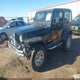 1J4FA59S12P701045 2002 Jeep Wrangler Sahara auction photo thumbnail 2
