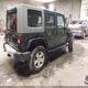 1J4BA5H15AL225685 2010 Jeep Wrangler Unlimited Sahara auction photo thumbnail 4