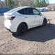 7SAYGAEE6PF804780 2023 Tesla Model Y Awd/Long Range Dual Motor All-Wheel Drive auction photo thumbnail 4