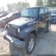 1J4BA3H15AL100416 2010 Jeep Wrangler Unlimited Sport auction photo thumbnail 2