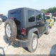 1J4BA3H15AL100416 2010 Jeep Wrangler Unlimited Sport auction photo thumbnail 4