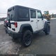 1C4BJWDG1FL513913 2015 Jeep Wrangler Unlimited Sport auction photo thumbnail 4