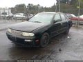 1997 Nissan Altima — photo 2 of 10 | VIN 1N4BU31D8VC100665