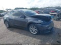 2023 Tesla Model Y — photo 1 of 16 | VIN 7SAYGAEE1PF968969
