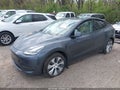 2022 Tesla Model Y — photo 2 of 21 | VIN 7SAYGAEE9NF428833