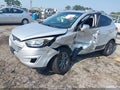 2014 Hyundai Tucson — photo 2 of 16 | VIN KM8JUCAG0EU830902