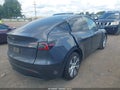 2023 Tesla Model Y — photo 4 of 18 | VIN 7SAYGDED6PF945373