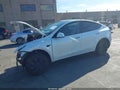 2024 Tesla Model Y — photo 2 of 17 | VIN 7SAYGDED6RF107721
