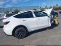 2024 Tesla Model Y — photo 4 of 17 | VIN 7SAYGDED6RF107721