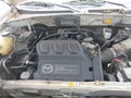 2004 Mazda Tribute — photo 9 of 11 | VIN 4F2YZ04154KM02473