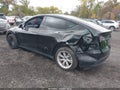 2023 Tesla Model Y — photo 3 of 17 | VIN 7SAYGDEE9PF858835
