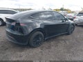 2023 Tesla Model Y — photo 4 of 17 | VIN 7SAYGDEE9PF858835