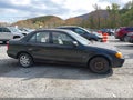 1999 Mazda Protege — photo 13 of 16 | VIN JM1BJ2228X0182427