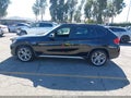 2013 BMW X1 — photo 14 of 16 | VIN WBAVM1C54DVW45750