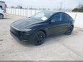 2026 Tesla Model Y — photo 2 of 15 | VIN 7SAYGDEE3TA472595
